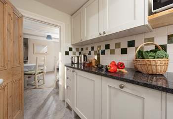 The cottage core kitchen with gorgeous granite worktops.