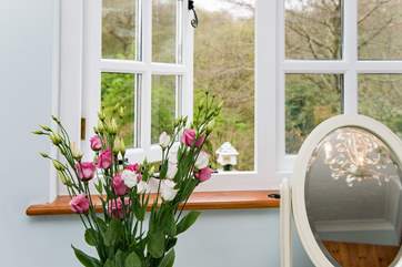 ...and enjoys delightful views across the garden.