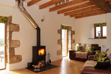 The sitting-area has floor length windows to make the most of the views.
