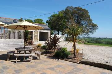 There is a spacious patio outside the living-room.