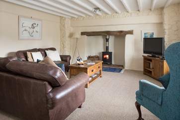 After an action-packed day, this welcoming sitting-room with glowing wood-burner awaits.