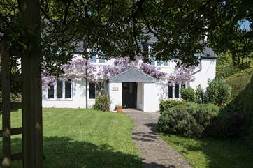Such a stunning cottage awaits as you step through the entrance gate.