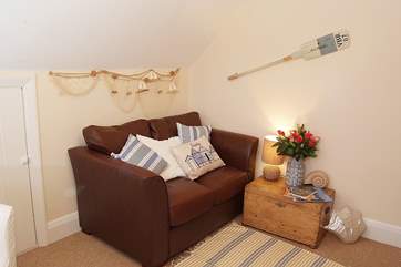 The cosy sitting-room is a little home-from-home.