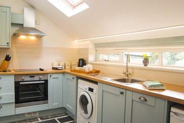 The pretty pastel-coloured kitchen.