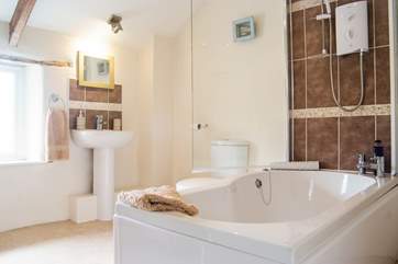 The en suite bathroom is spacious.