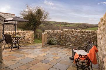 The enclosed courtyard is a wonderful sun trap and has lovely views over rolling countryside.