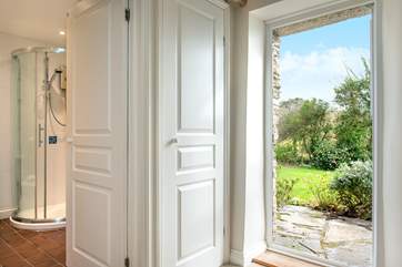 Bedroom one has an en suite shower-room and a door leads out to the garden.