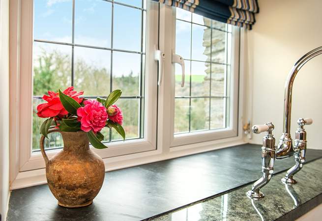 From the kitchen you can enjoy the view of the garden and the surrounding countryside.