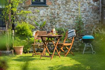 This peaceful garden can be a real sun-trap and a tranquil spot for a barbecue.