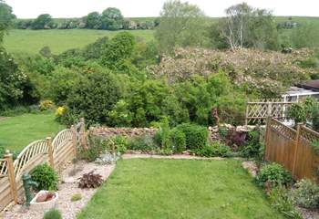 The attractive enclosed garden with countryside views beyond.
