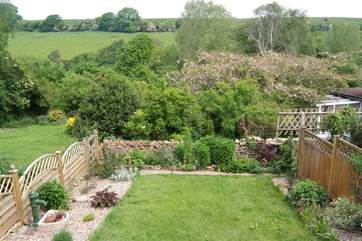 The attractive enclosed garden with countryside views beyond.