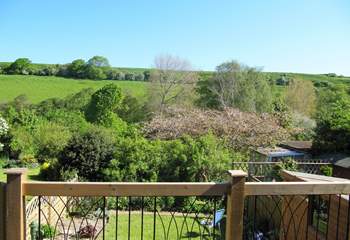 The decking above the garden at the back of the cottage  is a delightful place to sit and enjoy the view right across the valley.