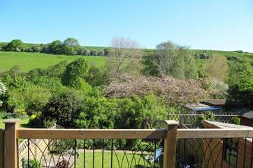 The decking above the garden at the back of the cottage is a delightful place to sit and enjoy the view right across the valley.