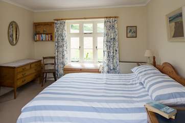 The double bedroom has countryside views on both sides.