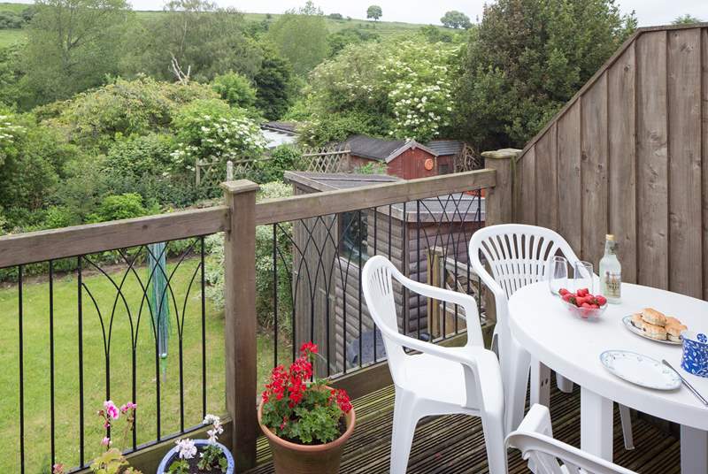 The decking above the garden at the back of the cottage is a relaxing place to sit and enjoy the view right across the valley.