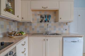 The country style kitchen suits the cottage perfectly.