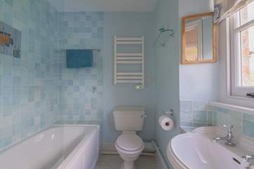 The family bathroom on the first floor, with shower over the bath.