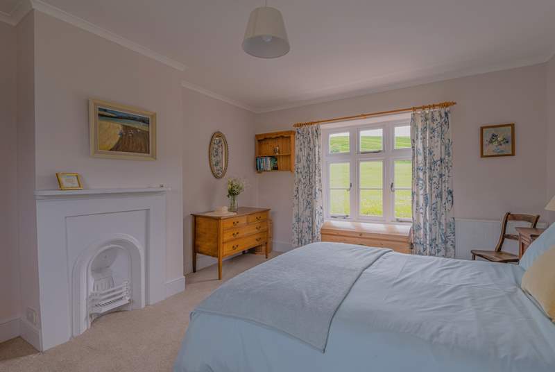 The double bedroom has countryside views on both sides.