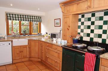 The farmhouse-style kitchen looks out over a 'secret' back garden.