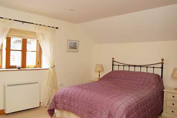 The spacious double bedroom.