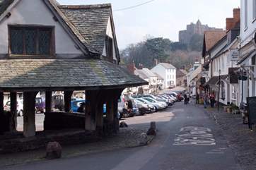 The main street of medieval Dunster, with the castle in the distance - now a National Trust property.