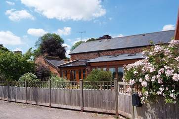 Knights Barton is a fabulous barn conversion with a lovely enclosed cottage garden.