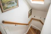 Oak stairs lead up to the first floor bedrooms.