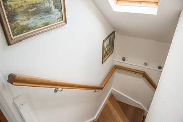 Oak stairs lead up to the first floor bedrooms.
