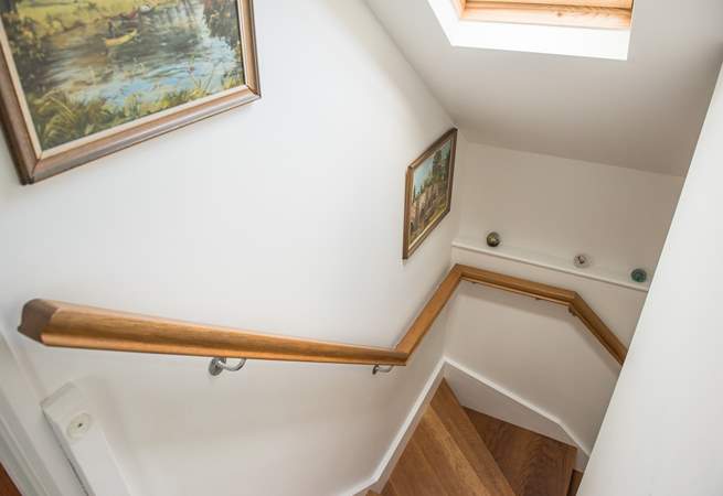 Oak stairs lead up to the first floor bedrooms.