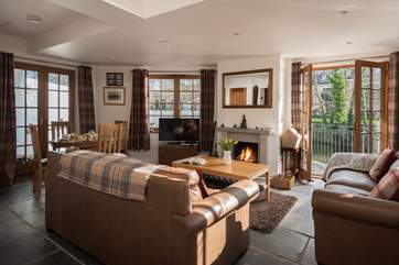 Comfortable sofas in front of the fire.