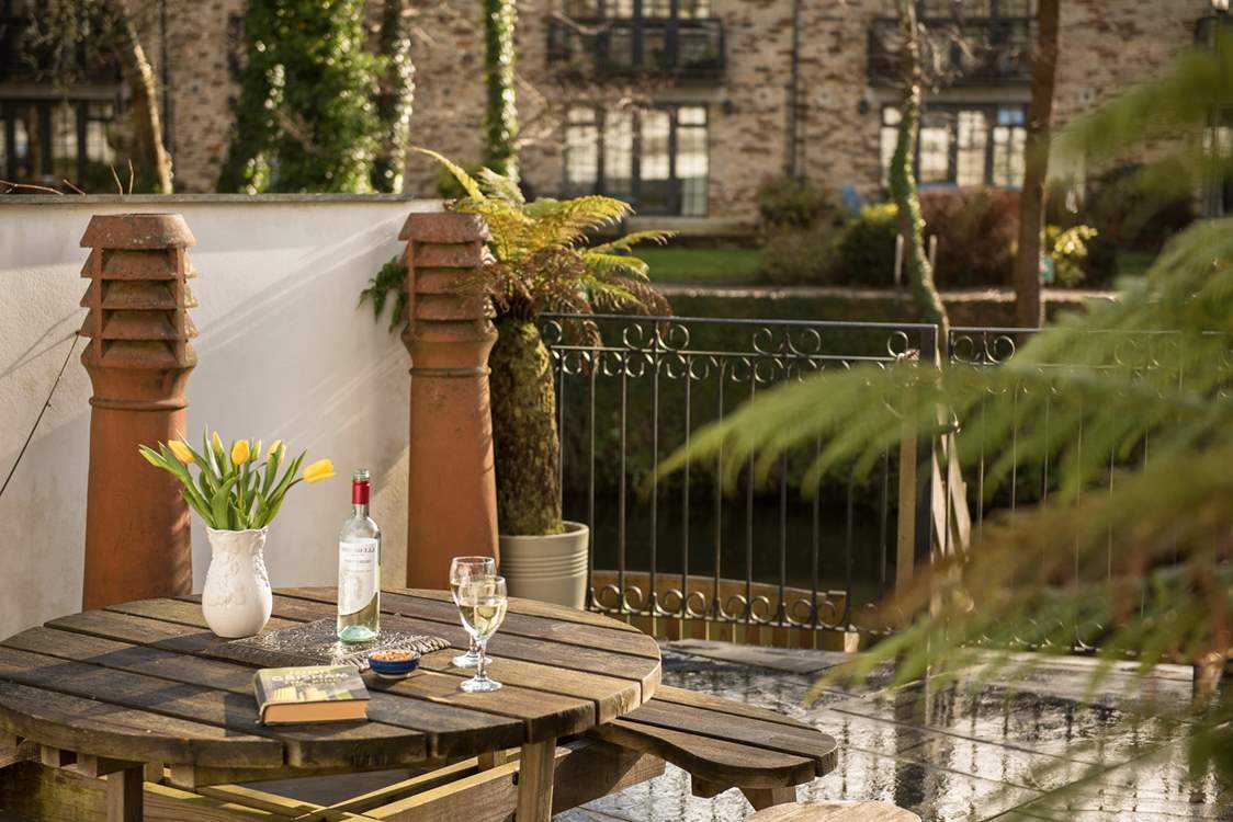 The terrace is right next to the water.