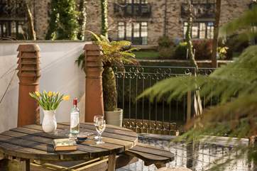 The terrace is right next to the water.