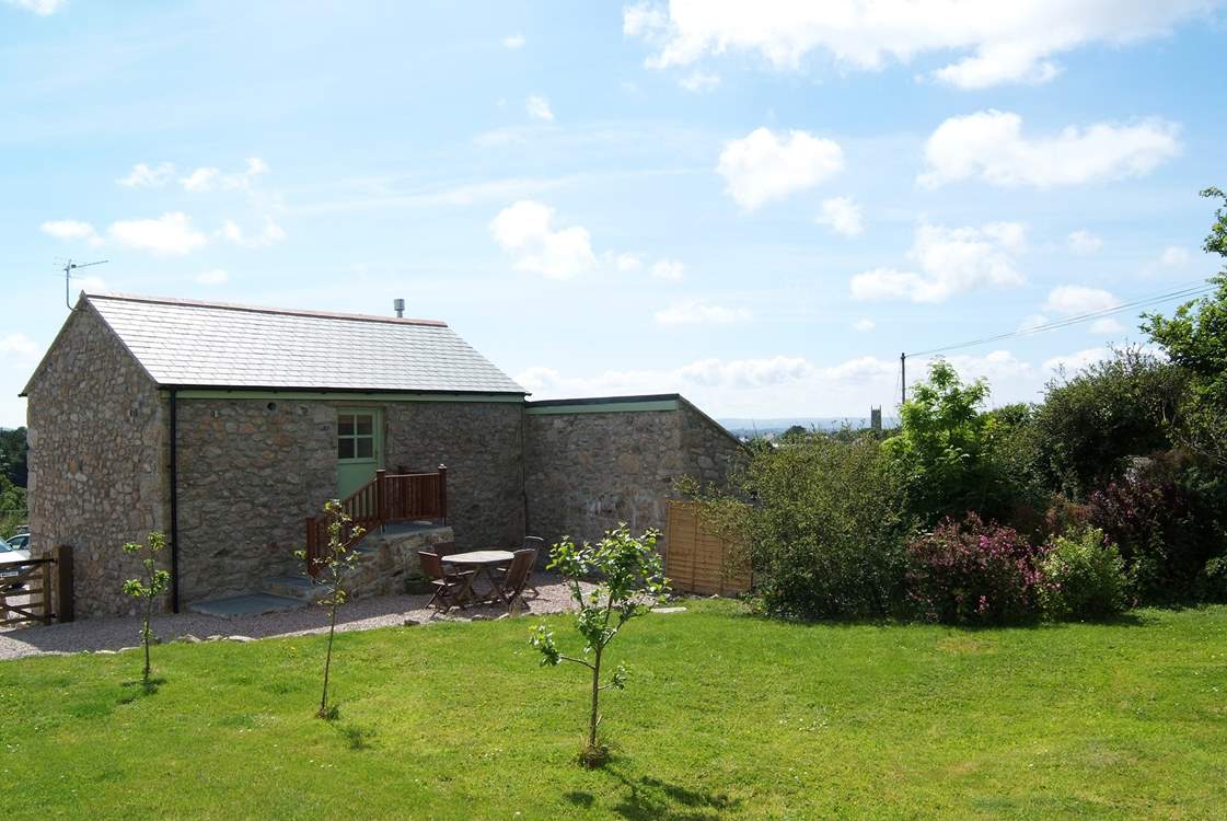 The spacious back garden is fully enclosed.