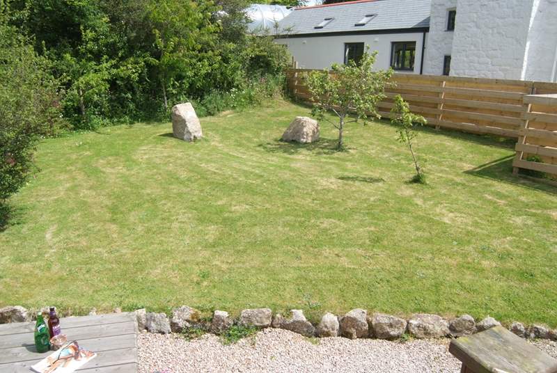 The lovely enclosed garden is perfect for relaxing in and for the little ones to have fun in.