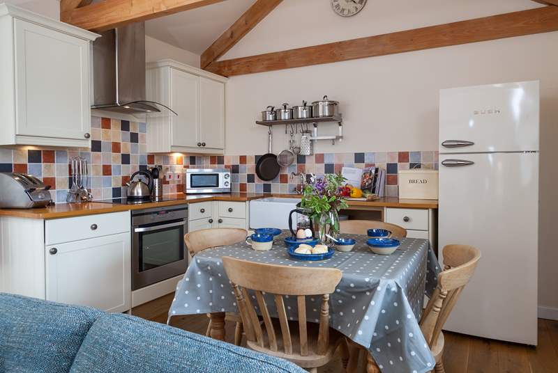 The kitchen is beautifully equipped and has a Belfast sink and woodblock work surfaces.