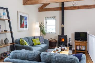 The living-room has lovely far reaching countryside views.