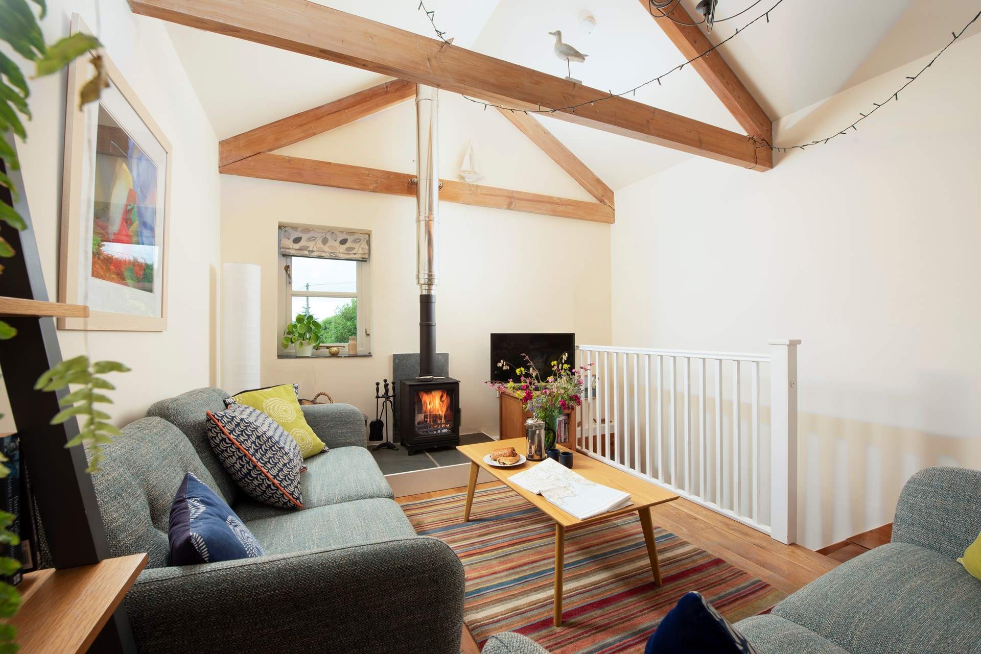 The characterful sitting-room has far reaching views of the valley.