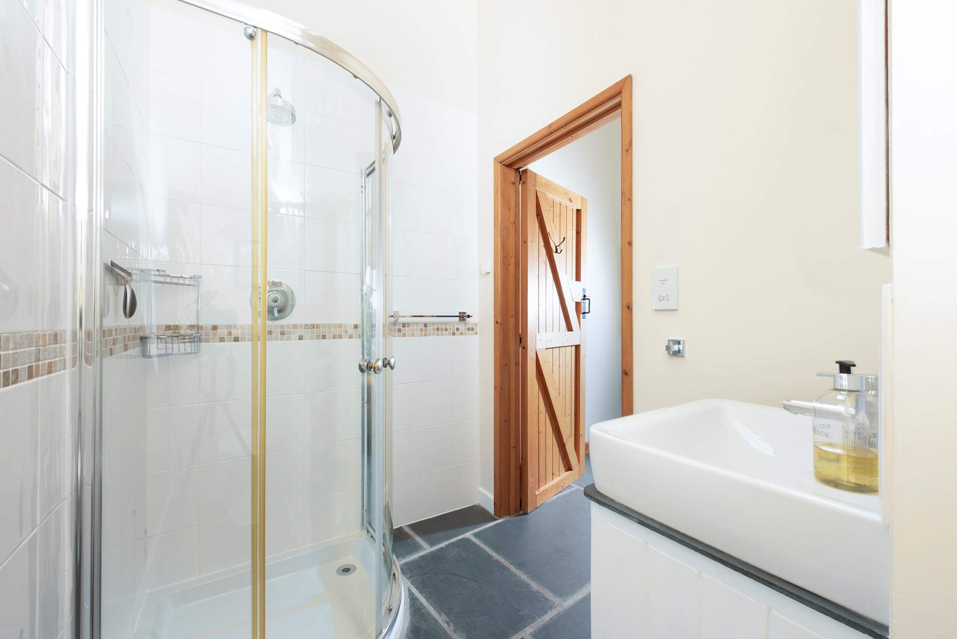 The en suite has a practical stand-up shower.