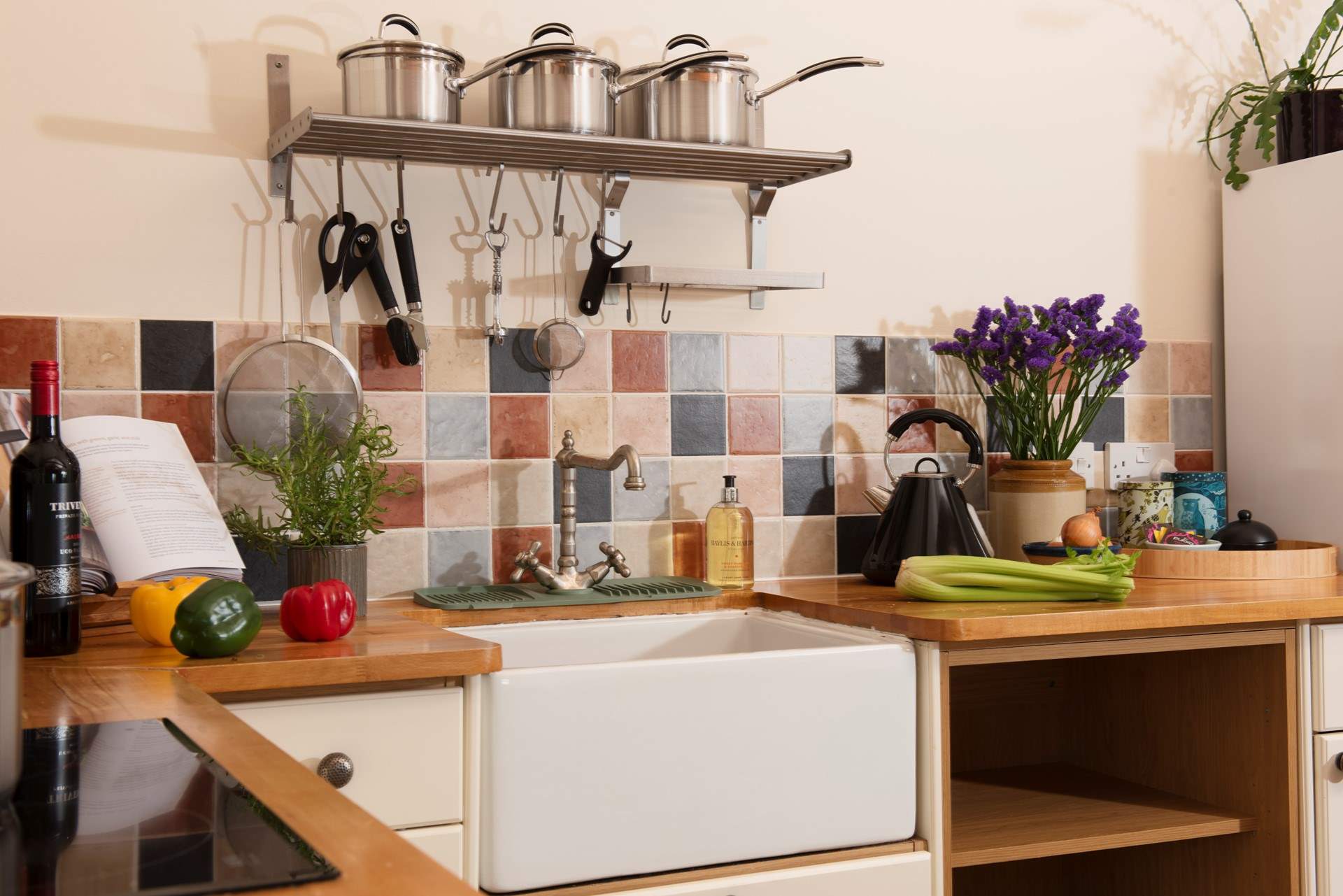 The kitchen features a Belfast sink.