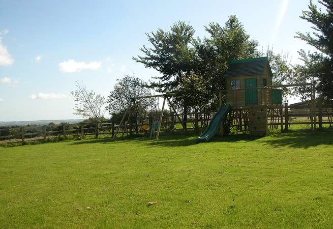 The large garden includes toddlers' swings and a raised Wendy House (please supervise younger children).