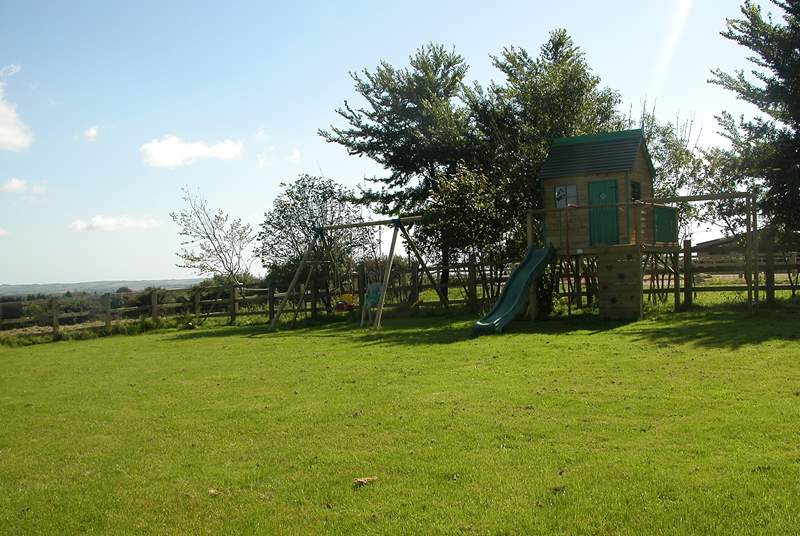 The large garden includes toddlers' swings and a raised Wendy House (please supervise younger children).