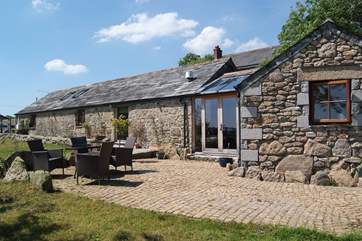 The sunny cobbled patio at Buny Whey.