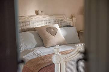 Pretty linens, cushions and throws in Bedroom 1.