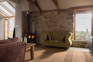 The cosy sitting-area has a wood-burner.