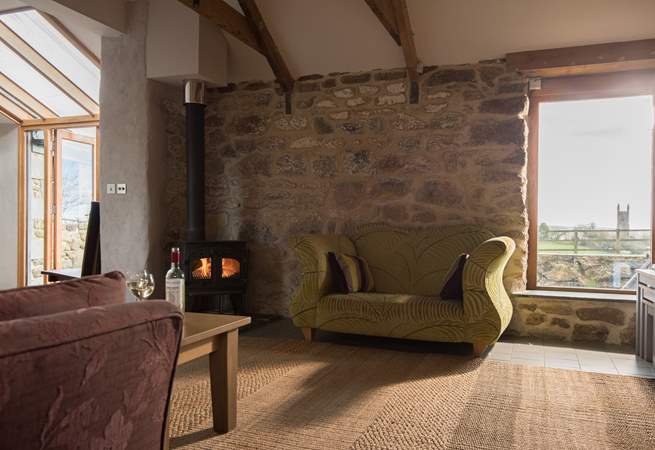 The cosy sitting-area has a wood-burner.