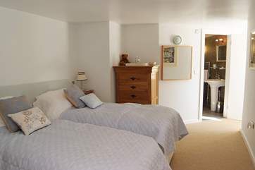The twin bedroom also has an en suite shower-room.