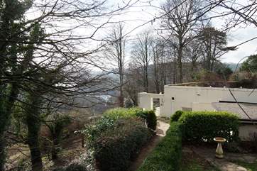 The stepped path down to the property, shown here in winter, with the glint of the River Dart in the background.
