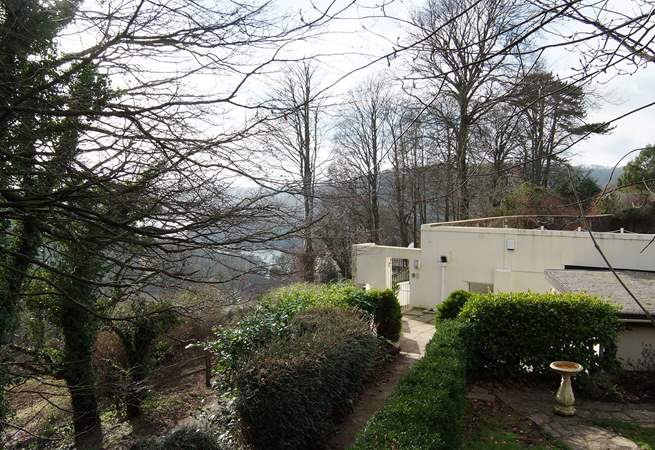 The stepped path down to the property, shown here in winter, with the glint of the River Dart in the background.