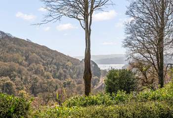 The view from the patio in front of the cottage, with the River Dart and Dartmouth in the distance and the steam railway running along the bottom of the valley.