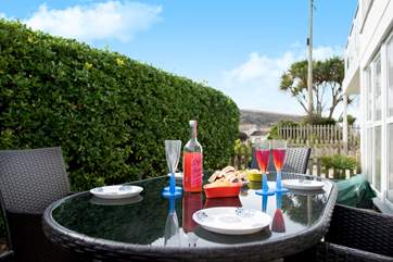 The patio catches the sun throughout the day.